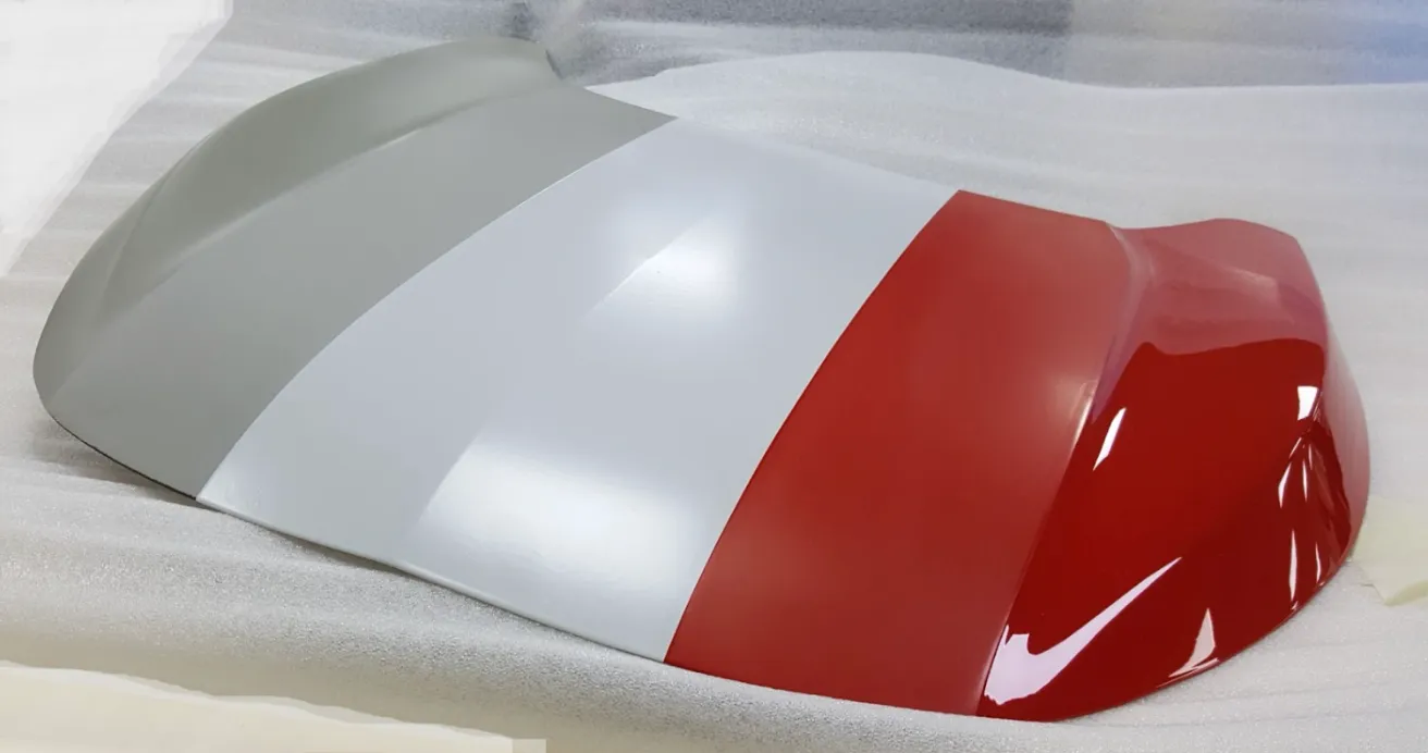 Class A Hood Component showing stages of paint process